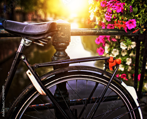 beautiful old bicycle on a bridge in Amsterdam photo