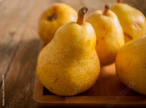 Fruit background. Fresh organic pears on old wood. Pear autumn harvest