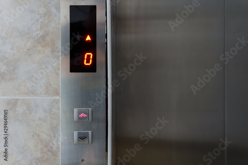 Metallic elevator panel with button and led display. Interior and closeup of metal buttons in elevator