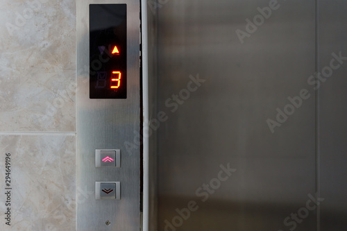 Metallic elevator panel with button and led display. Interior and closeup of metal buttons in elevator