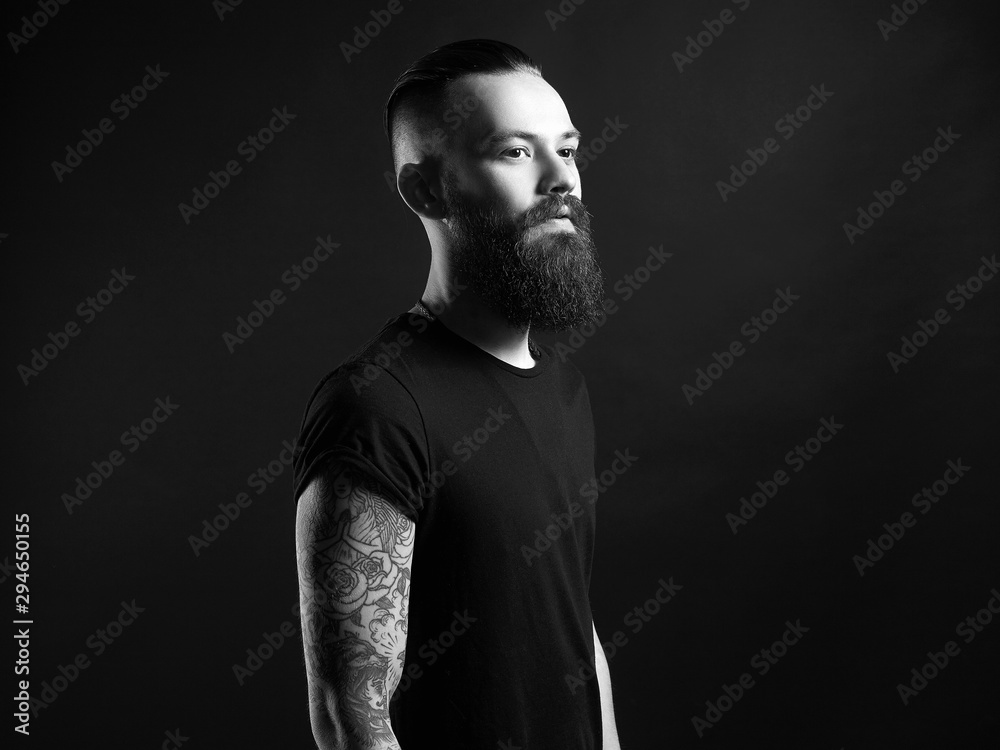 Boy with stylish haircut and tattoo. black and white portrait Boy with stylish haircut and tattoo. black and white portrait