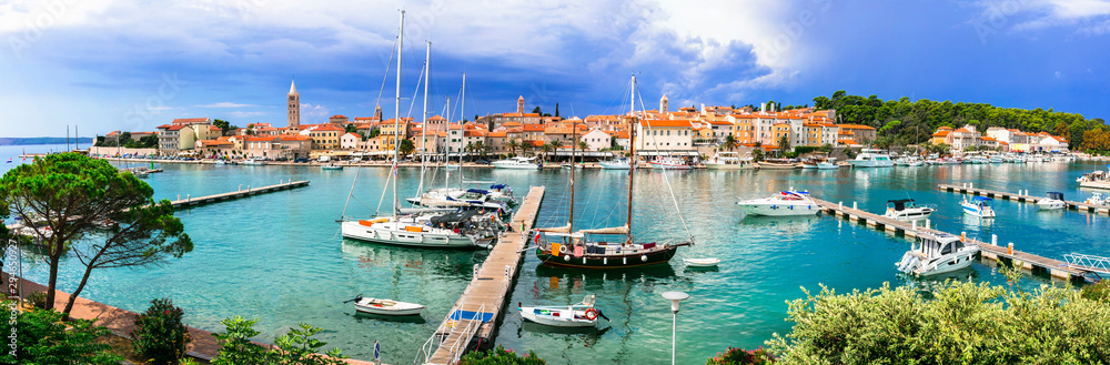 Travel in Croatia- beautiful island Rab. Panoramic view of marine and old town - obrazy, fototapety, plakaty 