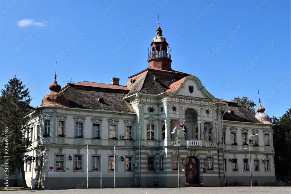 Old building with a roof from a brown tile, classic style.