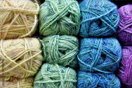 multi-colored balls of yarn: yellow, blue, green, lilac
