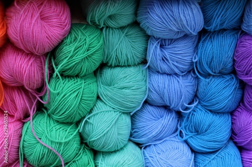 multi-colored balls of yarn: pink, blue, green, lilac