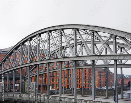 A bridge over a canal in the Speicherstadt in Hamburg Germany © zimmytws