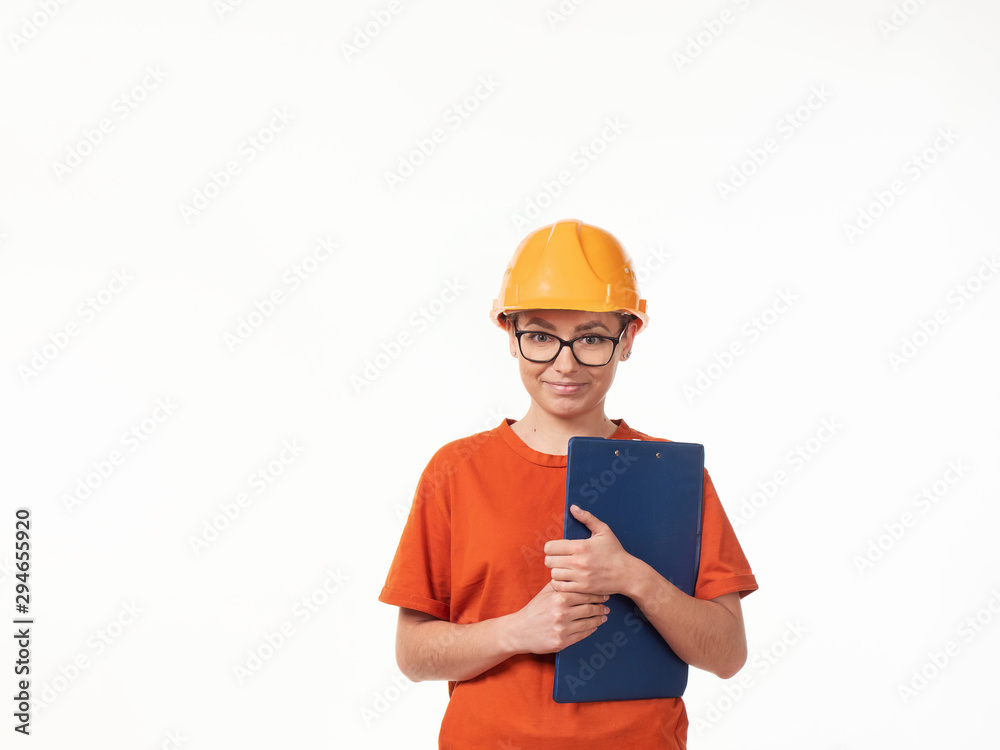 beautiful foreman girl in a yellow helmet with a blue folder on a white background beautiful foreman girl in a yellow helmet with a blue folder on a white background