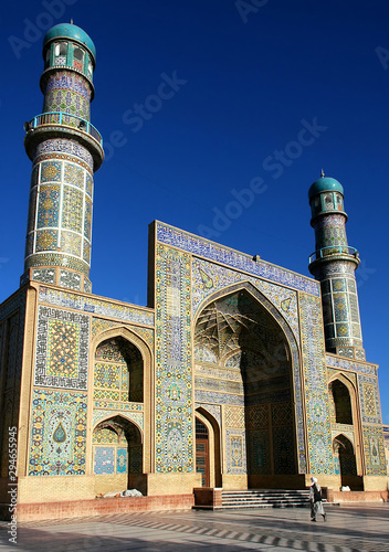 Herat in western Afghanistan. The Great Mosque of Herat (Friday Mosque or Jama Masjid). The mosque is decorated with mosaics and Quranic calligraphy. Friday Mosque with people in Herat, Afghanistan.