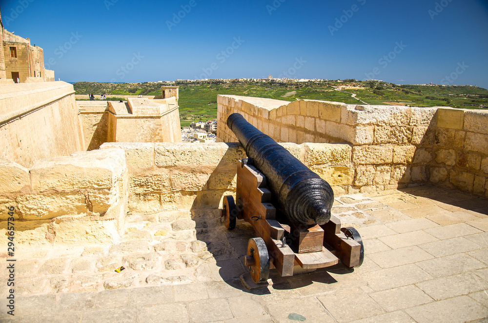 Gozo island, Malta - March 12, 2017: Cannon on walls of the old medieval Cittadella tower castle, also known as Citadel, Castello in the Victoria Rabat town