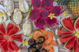 Tropical fruits assortment, closeup, top view. Many colorful ripe fruits background. Durian, papaya, watermelon, banana, mangosteen, pineapple and pitahaya or dragon fruit in island Bali, Indonesia