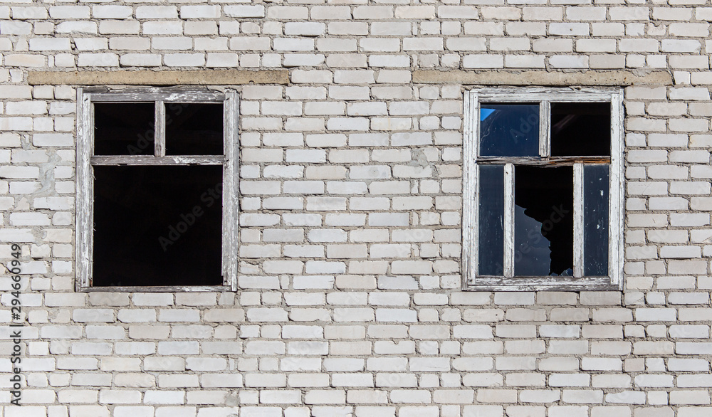 Broken windows of a brick house Broken windows of a brick house