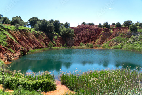 Bauxite Quarry Lake in Otranto, Puglia, Italy. Salento, Otranto: lunar landscape of the lake of the bauxite quarry cave.