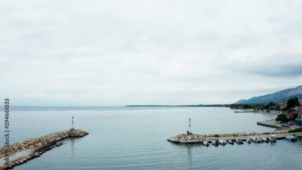 Drone flying over boat harbor near the city. Aerial view of sea water. Drone flying over boat harbor near the city. Aerial view of sea water.