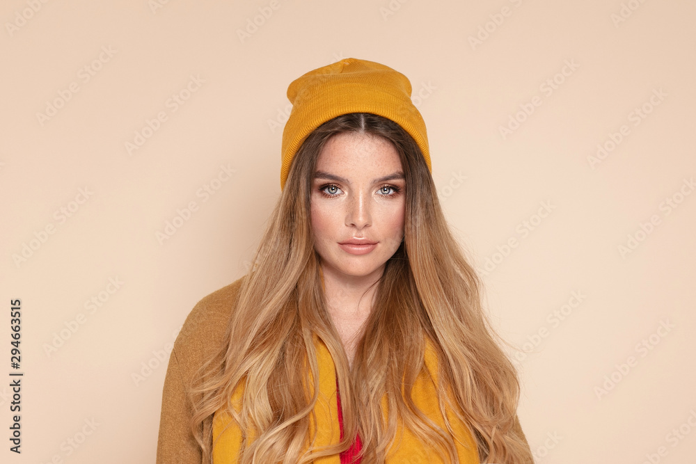 Fashionable girl in autumn yellow cap. Fashionable girl in autumn yellow cap.