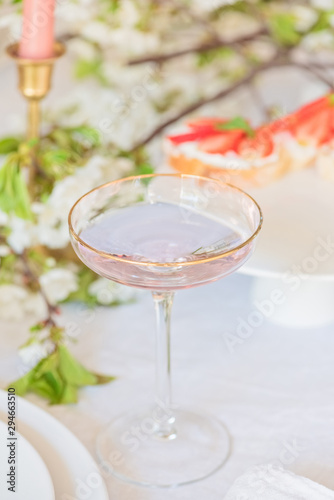 Fruits martini in a festive glass, wedding boho`s table closeup