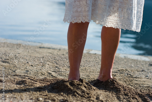 female legs on the beach © Jill