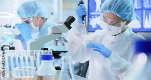 Asian scientist take petri dish