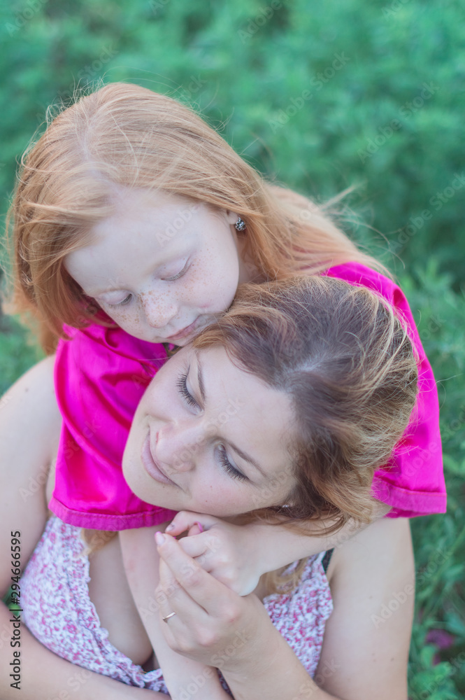 Happy mother with her daughter in a field Happy mother with her daughter in a field