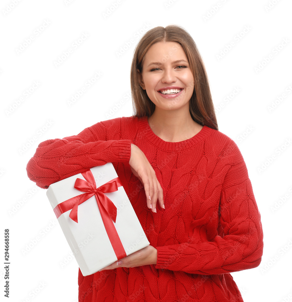 Happy young woman with Christmas gift on white background Happy young woman with Christmas gift on white background