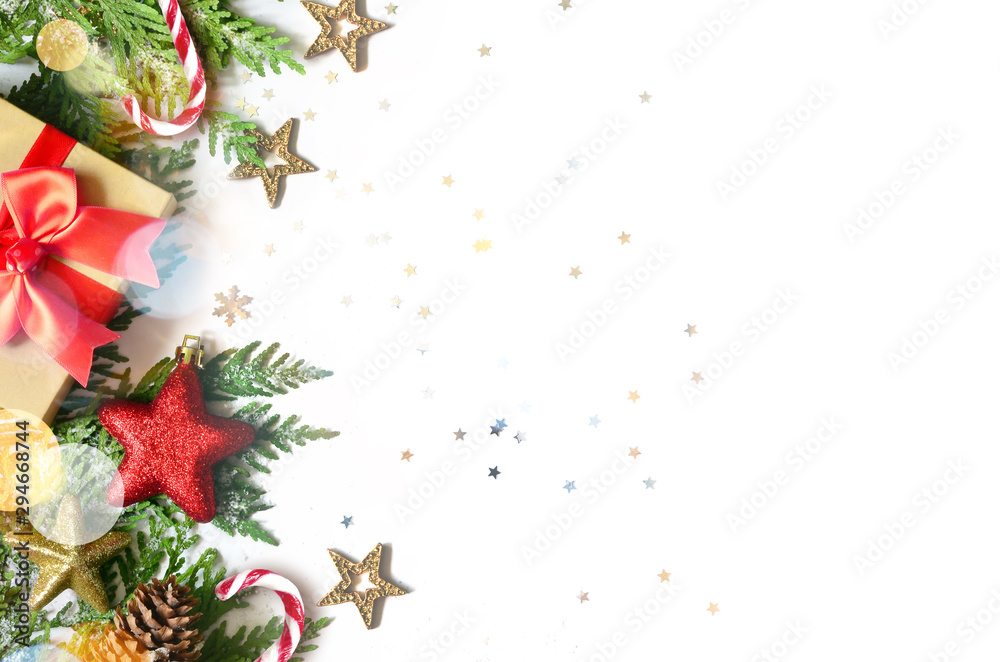 Christmas background, green pine branches, cones and gift box on white background. Creative composition with copy space, top view. New Year's holiday, christmas. Christmas background, green pine branches, cones and gift box on white background. Creative composition with copy space, top view. New Year's holiday, christmas.