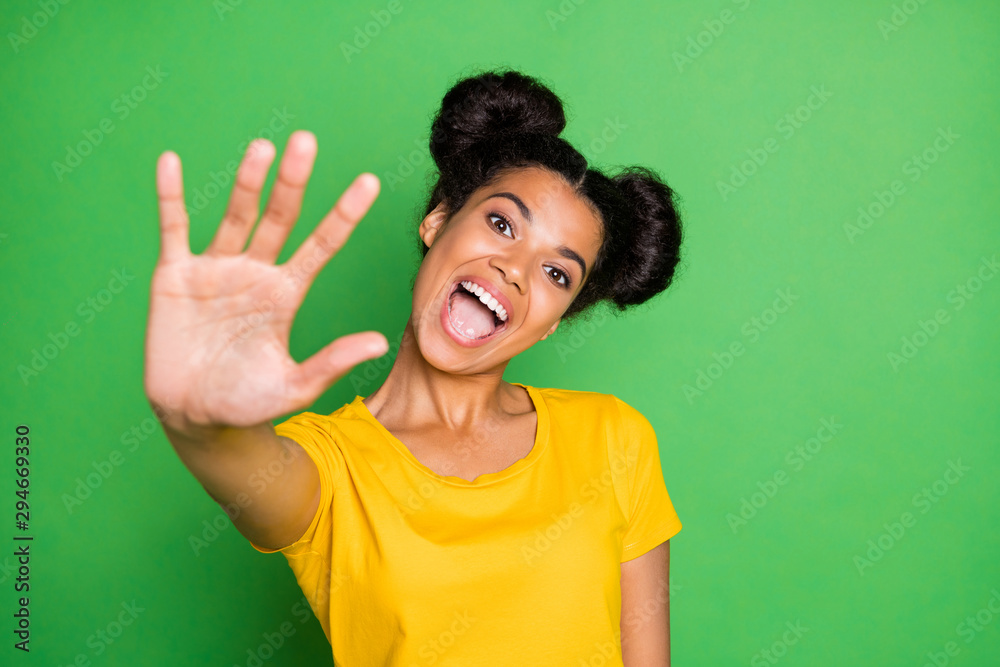 Give me five, buddy. Photo of pretty dark skin lady raise arm up greets friends overjoyed wear casual yellow t-shirt isolated green background Give me five, buddy. Photo of pretty dark skin lady raise arm up greets friends overjoyed wear casual yellow t-shirt isolated green background