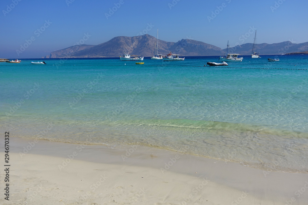 Photo of famous sandy turquoise beach of Ammos near main port of Koufonisi island, Small Cyclades, Greece