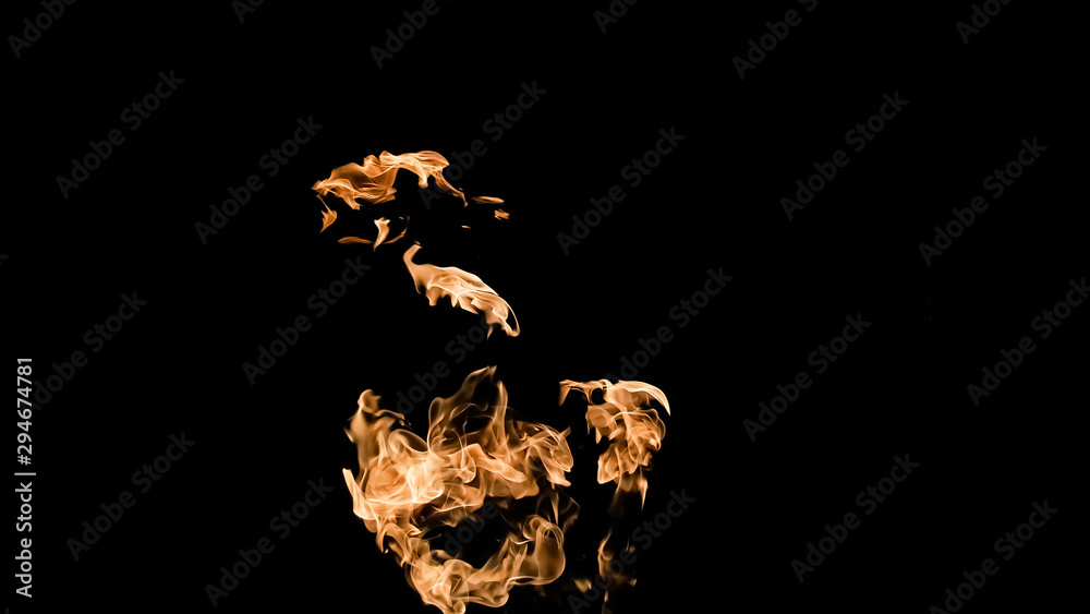 Fototapeta premium Fire flames on black background. fire on black background isolated. fire patterns