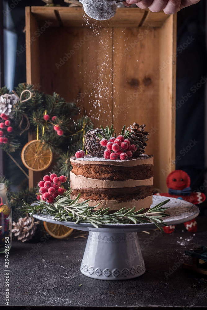  Christmas cake with citrus and ginger cake on a white dishes with green