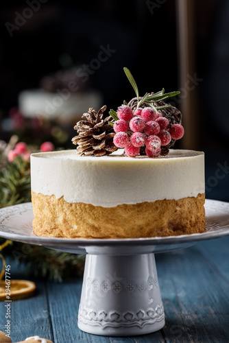 Double Christmas heesecake with berries on a dark background photo