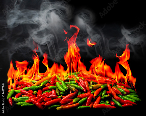 Group of Red Hot chili pepper on fire and smoke photo