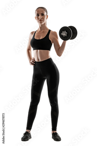 Brunette woman in black leggings, top and sneakers is posing isolated on white. Fitness, gym, healthy lifestyle concept. Full length.