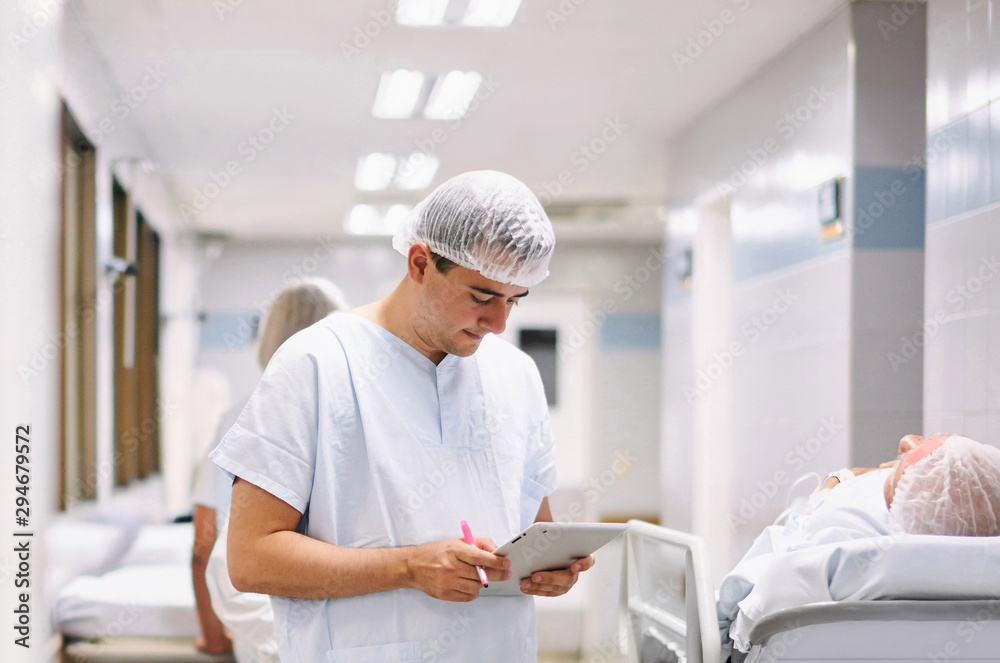 Nurse taking information from a patient Nurse taking information from a patient