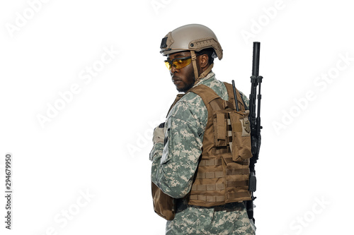 Professional American soldier wearing uniform with weapons.