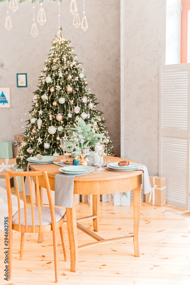 Christmas table, a glass of champagne, pine on plate, table setting