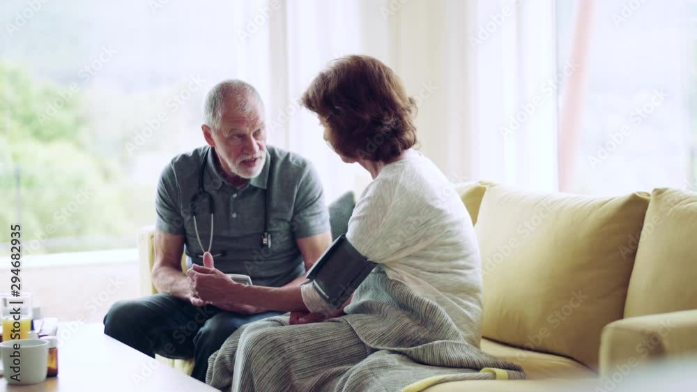 Health visitor and a senior woman during home visit. Health visitor and a senior woman during home visit.