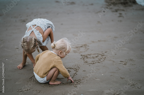 Sisters playing on a beach
