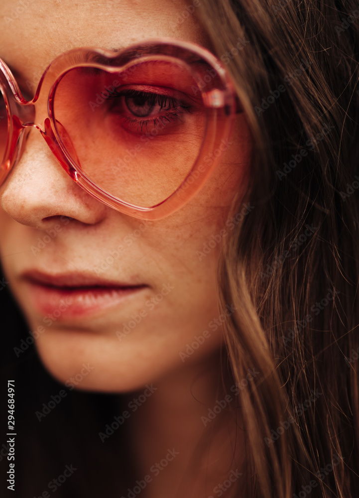 Closeup of young woman with Heart Shape Glasses Closeup of young woman with Heart Shape Glasses