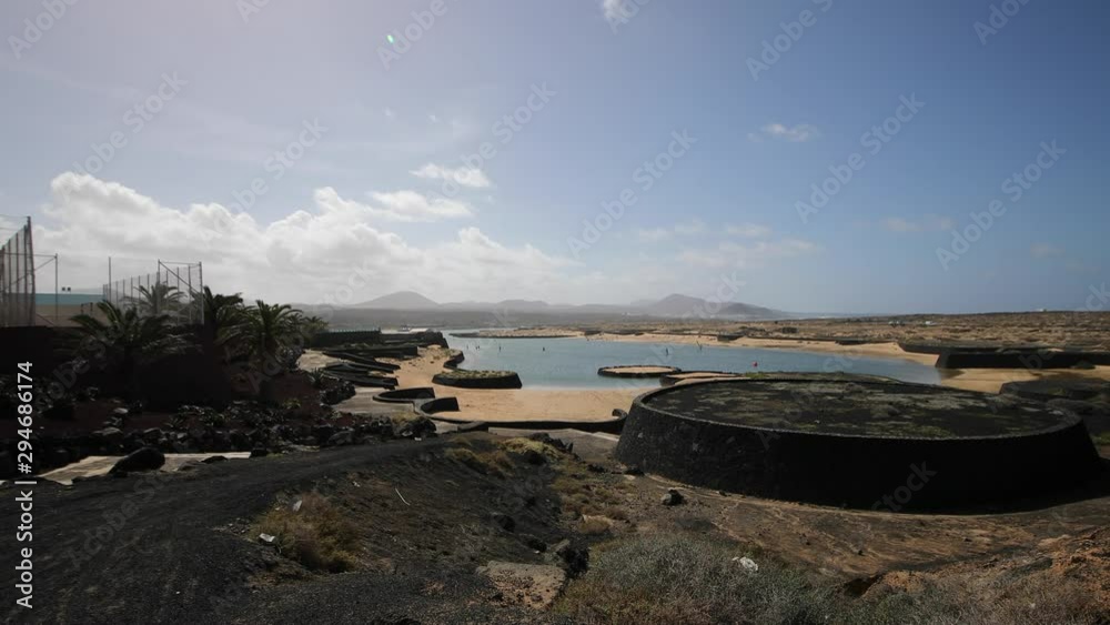 View from the road to a private sandy beach on the Canary Islands in Lanzarote. Shot in motion. View from the road to a private sandy beach on the Canary Islands in Lanzarote. Shot in motion.
