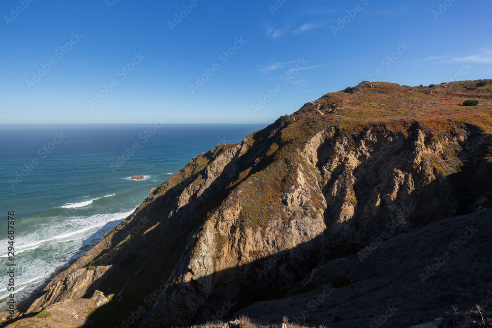 Scenic view of the Atlantic Ocean and hilly coast near Cabo da Roca, the westernmost point of mainland Europe, in Portugal.