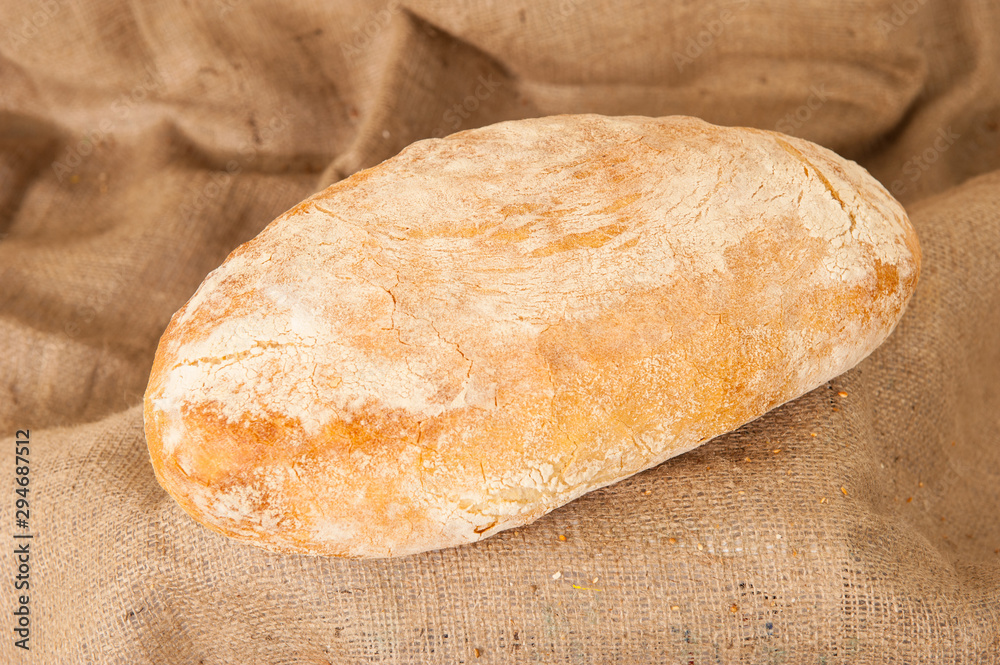 white bread on burlap background white bread on burlap background