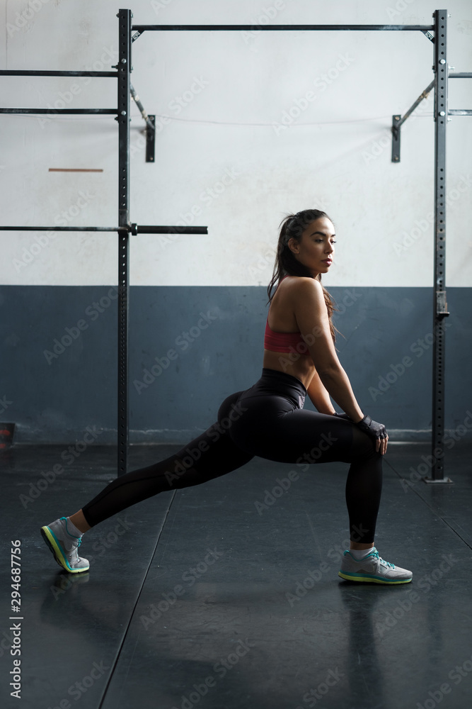 Young Woman Working Out At The Gym