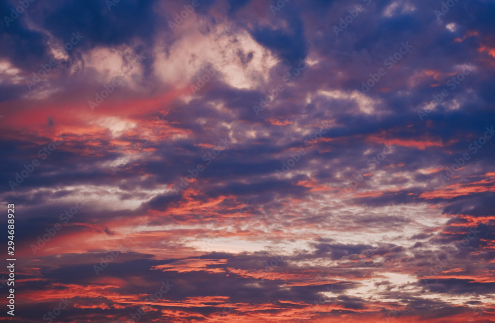 Colorful clouds on sunset sky, nature background