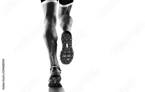 Fototapeta Naklejka Na Ścianę i Meble -  Sports background. Runner feet running closeup on shoe. Isolated on white.