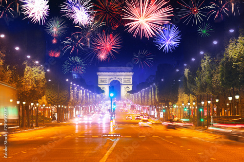 Arc de triumph at Paris and fireworks in night sky photo