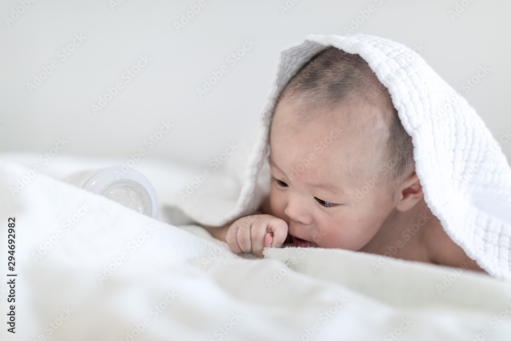 Happy 4 months baby boy crawling with chewing his fingers Happy 4 months baby boy crawling with chewing his fingers