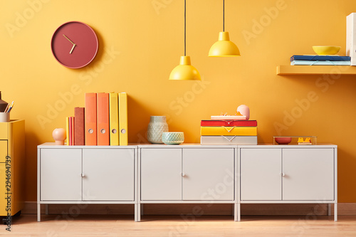 Cabinet with colorful folders in modern office