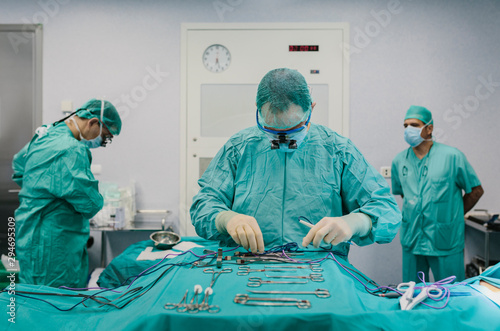 Surgeons in the operating room preparing the tools