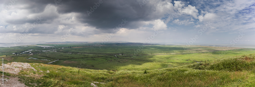 Panorama of marsh in green fields