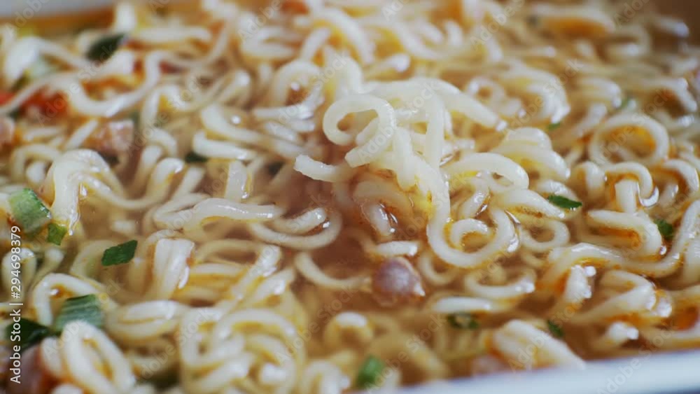 fastfood.dry chinese noodles with broth and spices.close-up fastfood.dry chinese noodles with broth and spices.close-up