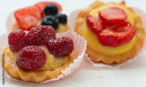 cupcakes with fresh seasonal fruit. Fresh fruit tart with cream and jelly